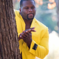Spice adams hiding behind a tree