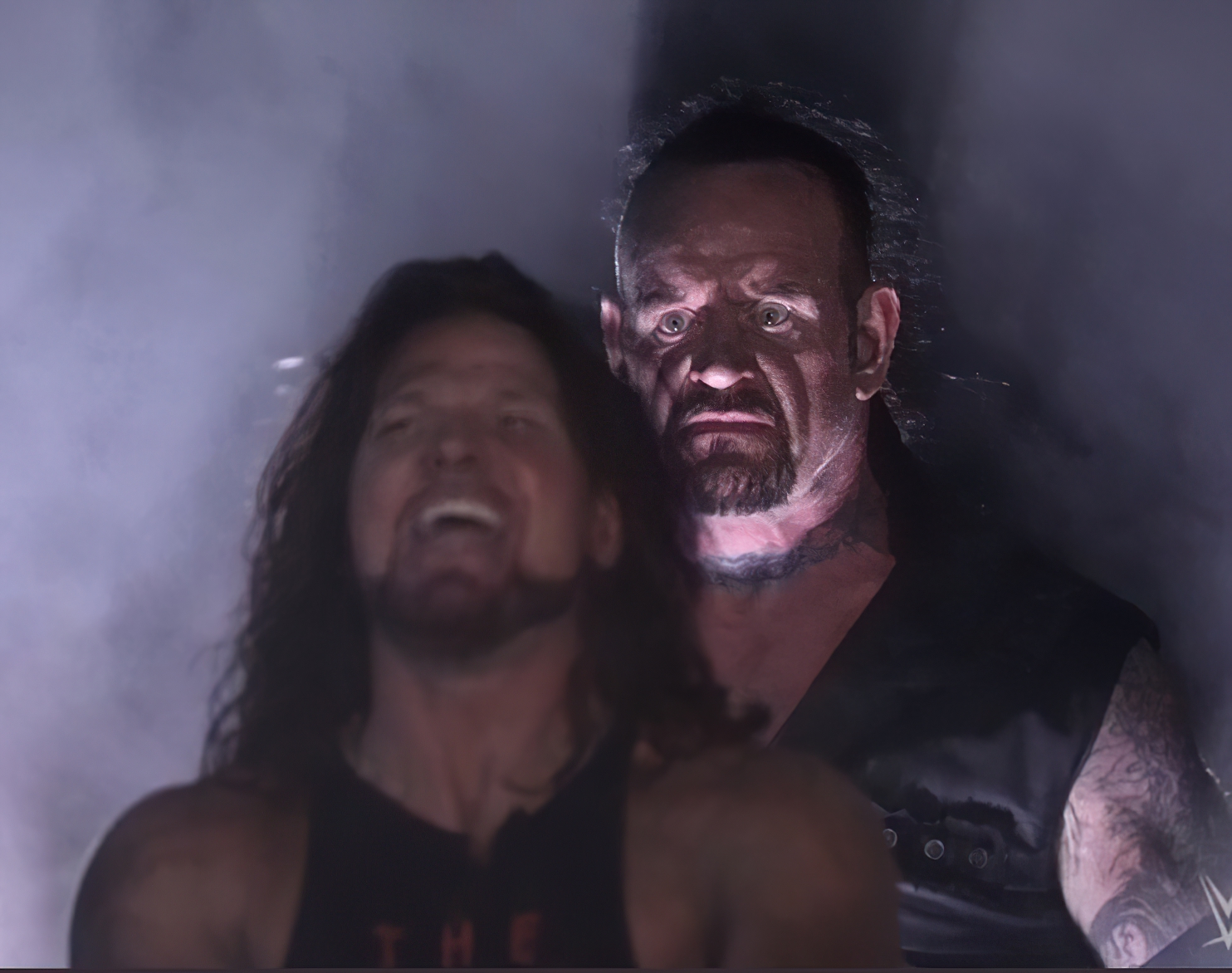 undertaker standing behind