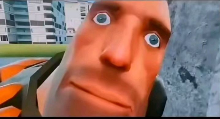 TF2 Heavy qui fixe l'écran avec des yeux ronds, choqué, stupéfié