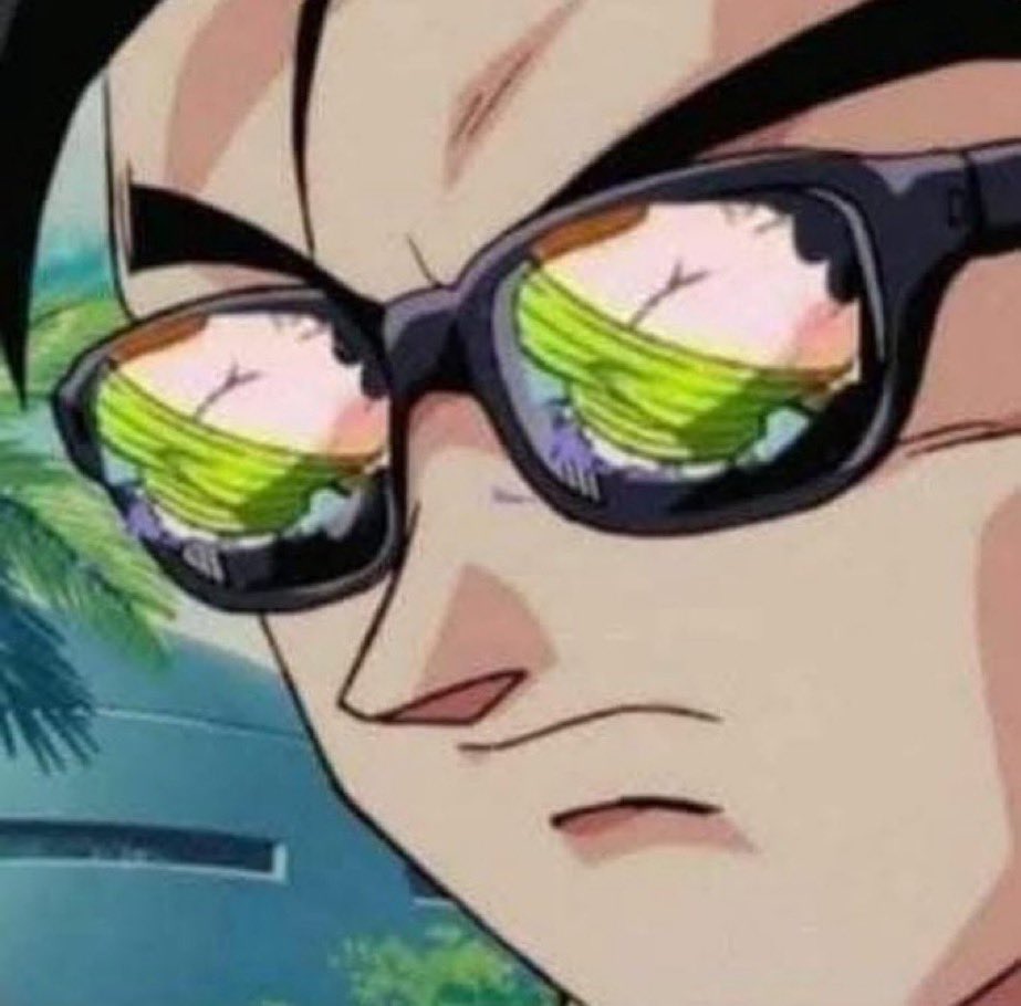 Goku avec des lunettes de soleil reflétant une paire de seins