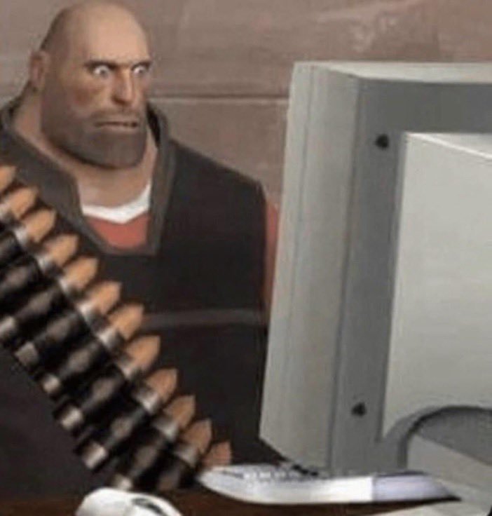 Heavy de Team Fortress 2 fixe un ecran d ordinateur avec choc