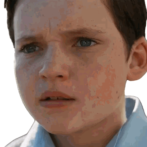 garçon qui ferme les yeux et grimace de douleur émotionnelle en fondant en larmes