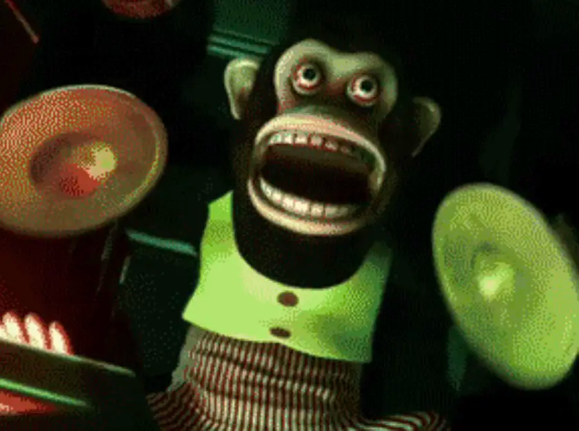 Singe mécanique de Toy Story qui hurle avec ses cymbales
