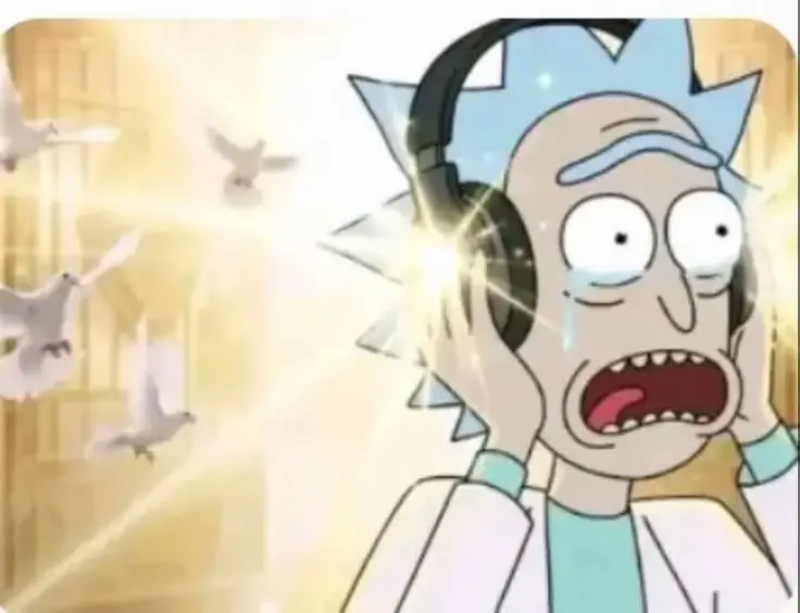 Rick Sanchez ecoute de la musique avec un casque et pleure de joie