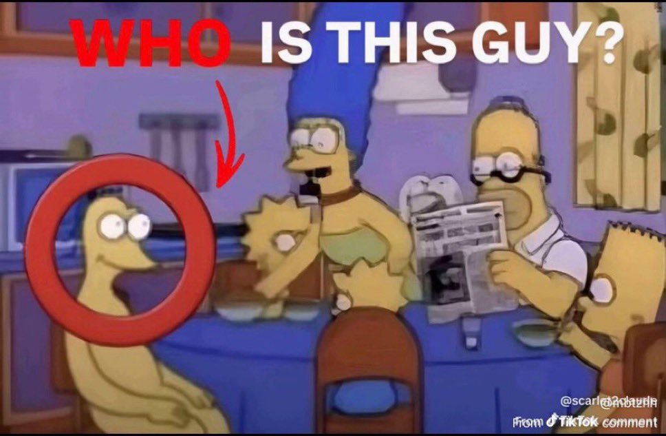 WHO IS THIS GUY ? Graggle Simpson assis avec la famille Simpson à table